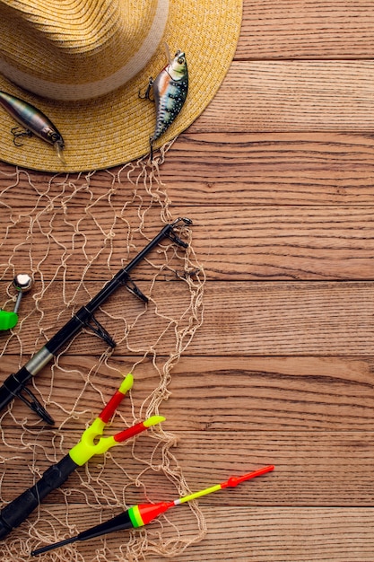 Free photo top view of colorful fishing hat with essentials