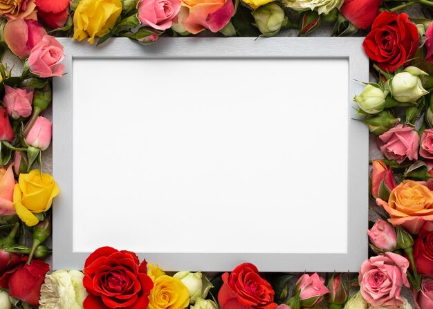 Top view of colorful flowers with blank frame