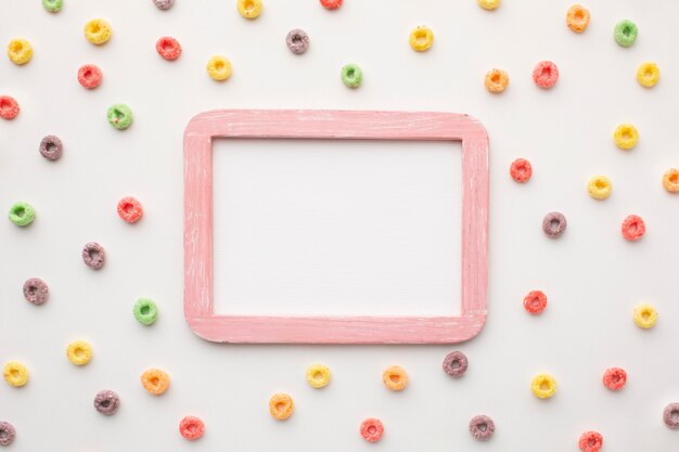 Top view colorful frame surrounded by cereal