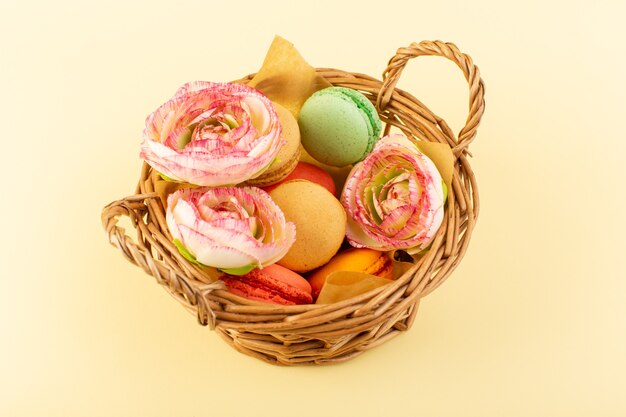 A top view colorful french macarons inside basket