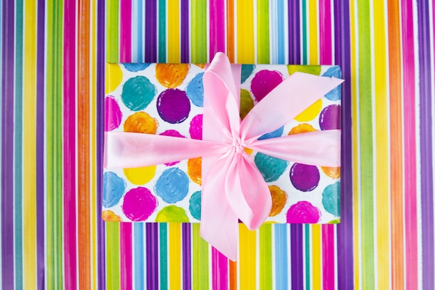 Top view colorful gift on colorful background