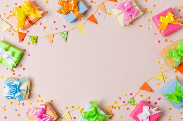 Top view colorful gifts on table 