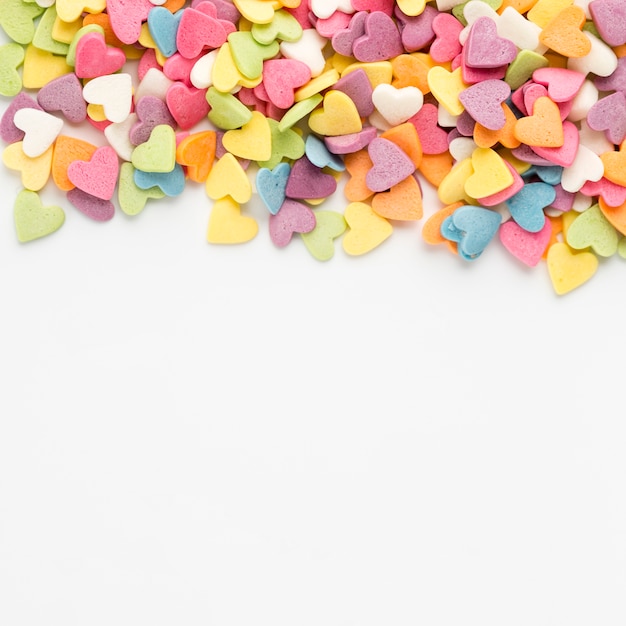 Top view of colorful heart-shaped sweets