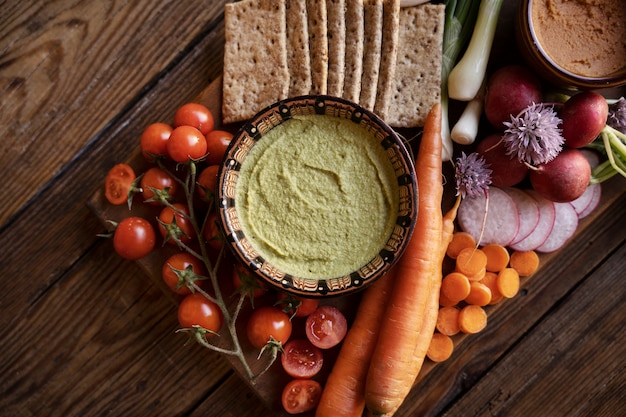 Free photo top view over colorful hummus