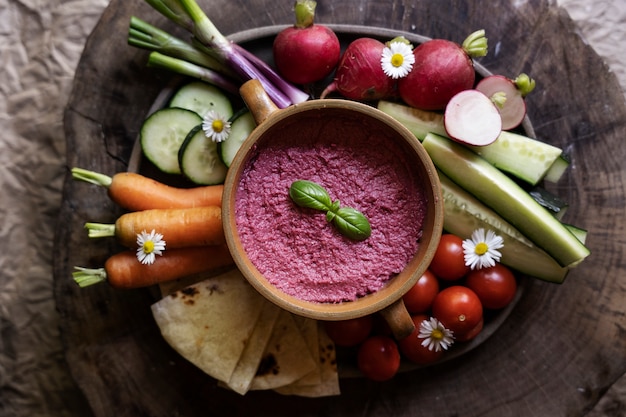 Free photo top view over colorful hummus