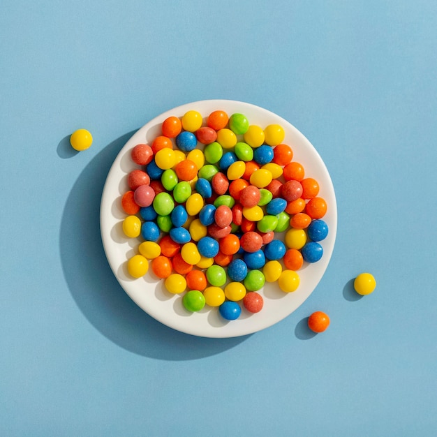 Top view of colorful jelly beans on plate