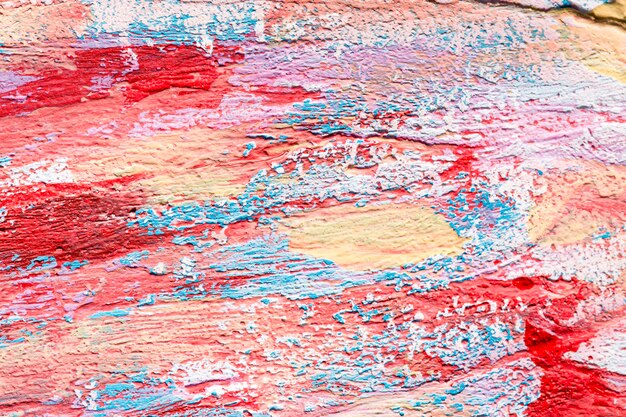 Top view of colorful paint brush strokes on surface