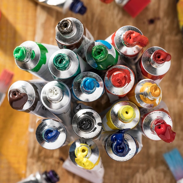 Free photo top view of colorful paint tubes