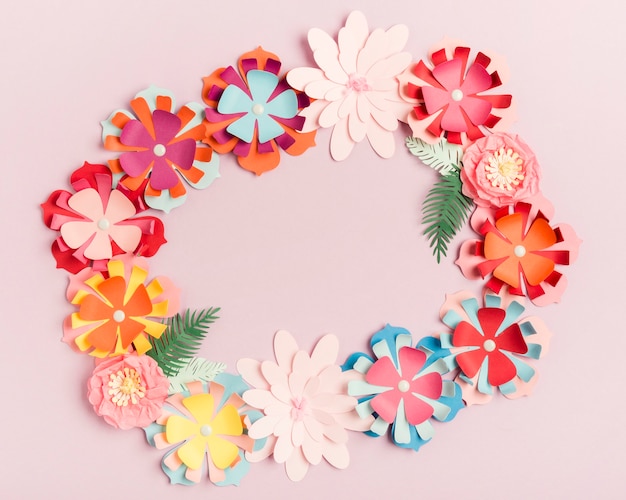 Top view of colorful paper spring flowers wreath