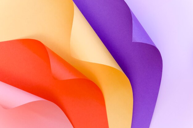 Top view of colorful paper with bent corners