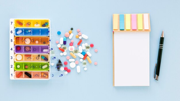 Top view colorful pillboxes with medicine