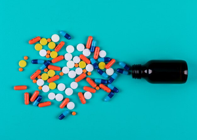 Top view of colorful pills from bottle