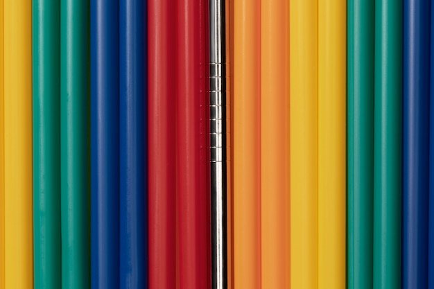 Free photo top view of colorful plastic straws mixed with metal