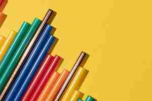Free photo top view of colorful plastic straws mixed with metal