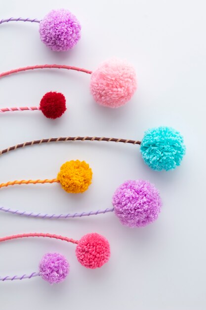 Top view colorful pom poms arrangement