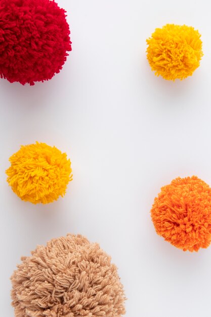 Top view colorful pom poms arrangement