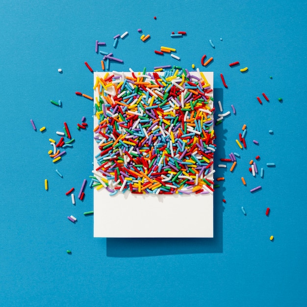 Top view of colorful sprinkles on photo