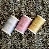 Free photo top view of colorful thread rolls