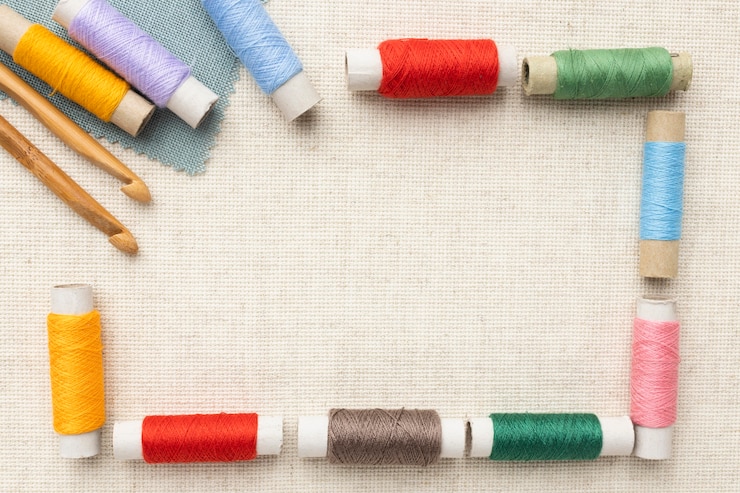 Free Photo top view colorful threads with copy-space