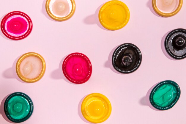 Top view colorful unwrapped condoms