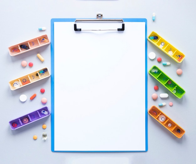 Free photo top view colorful variety of pillboxes on the table