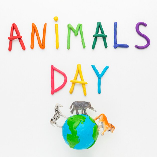 동물의 날을위한 동물 인형과 함께 다채로운 글쓰기와 지구의 평면도