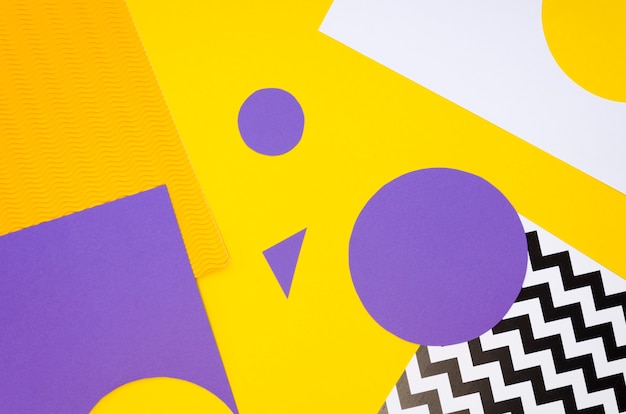 Top view of colourful paper shapes cut-outs