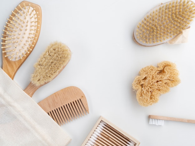 Top view comb and brushes on white background 