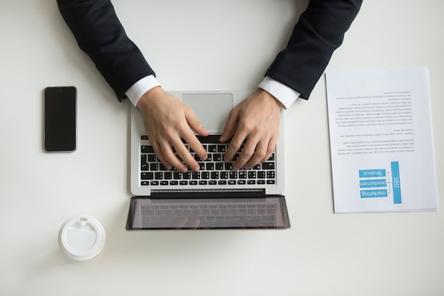 Free photo top view of company ceo typing at laptop