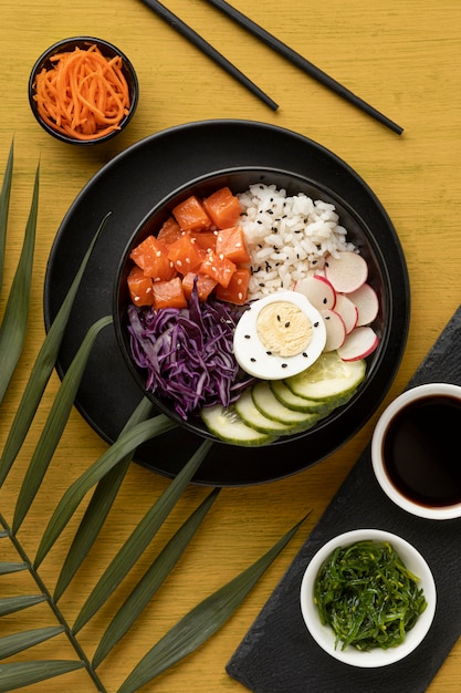 Top view composition of delicious poke bowl