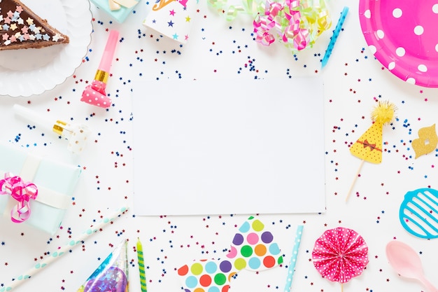 Top view composition of festive birthday items with empty card