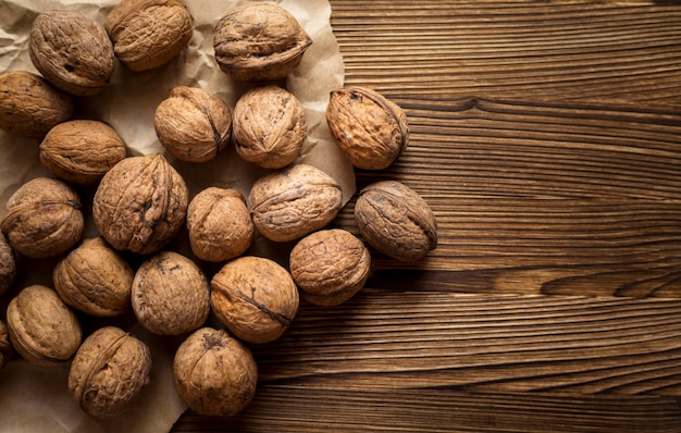 Free photo top view composition of fresh autumnal nuts with copy space