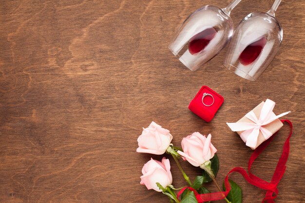 Top view composition with wine and engagement ring