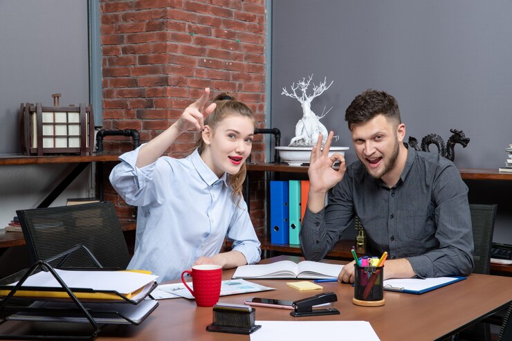 Free Photo top view of concentrated and motivated skilled workers brainstorming one issue in the office