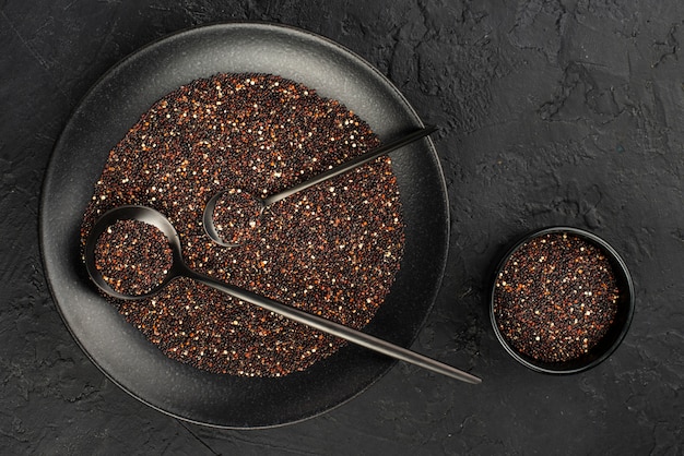 Top view of condiments in bowls with spoons