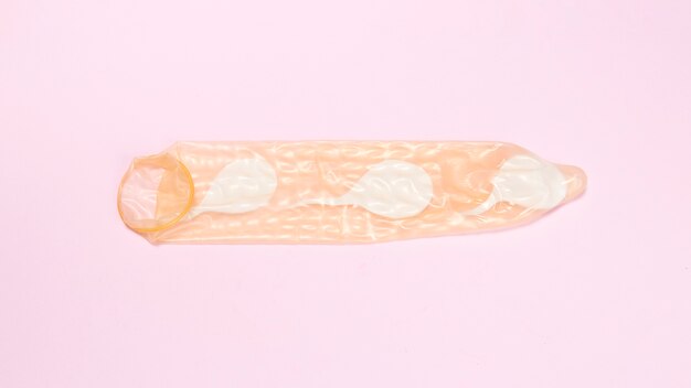 Top view condom with spermatozoa inside