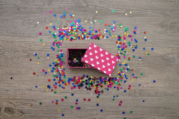 Top view of confetti frame with open gift box