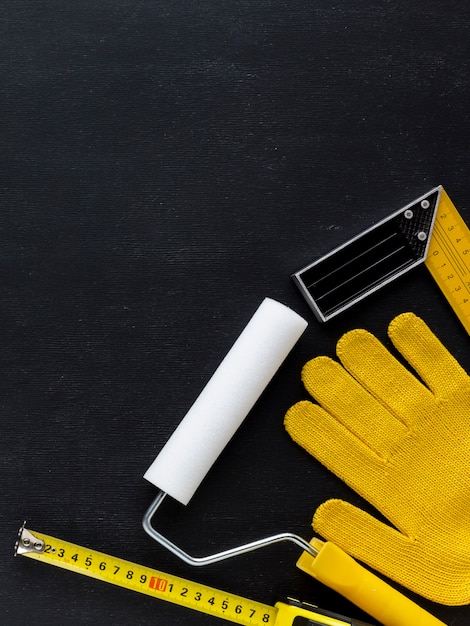 Free photo top view construction gloves and repair tools with copy space