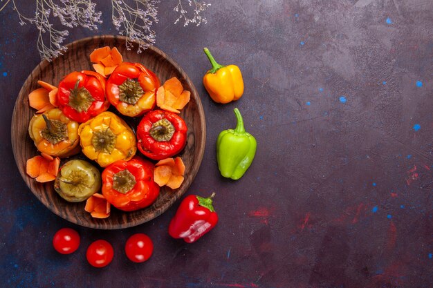 Top view cooked bell-peppers with ground meat on dark-grey background meat vegetables beef meal food