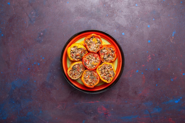 top view cooked bell-peppers with ground meat on grey floor food beef dolma vegetables meal