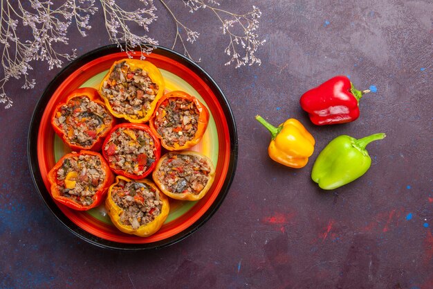 top view cooked bell-peppers with ground meat on a grey surface meal dolma beef food vegetables meat