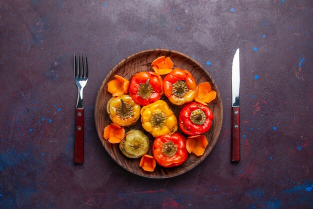 Top view cooked bell-peppers with ground meat inside on grey desk meal food meat vegetable cooking