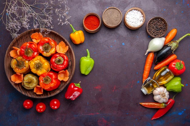 Top view cooked bell-peppers with ground meat and seasonings on grey surface meal dolma vegetables beef meat