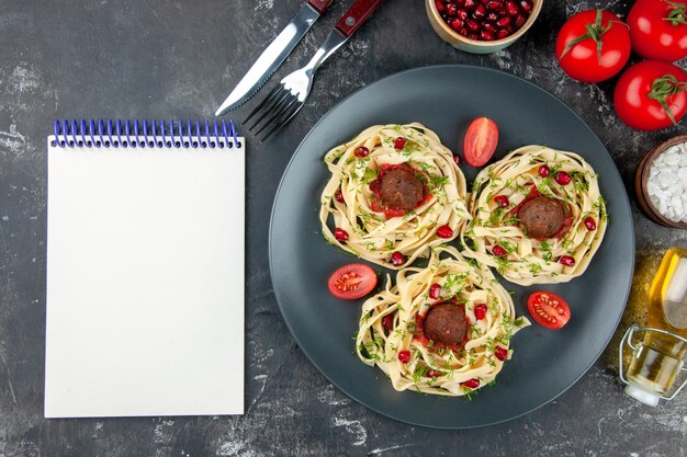 Top view cooked dough slices with meatballs on a gray background pasta meat dish color restaurant dinner cooking