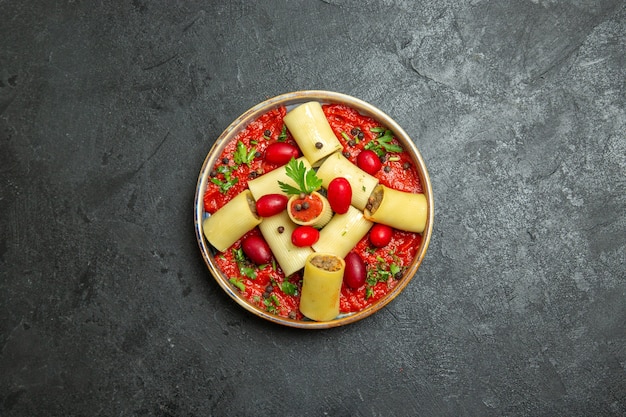 Top view cooked italian pasta delicious meal with meat and tomato sauce on grey background pasta dough meat dish food