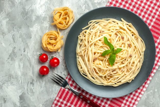 Top view cooked italian pasta inside plate on white background