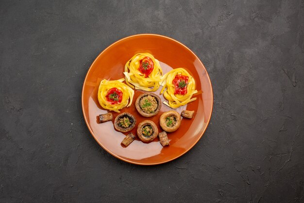 Top view cooked mushrooms with dough pasta on a grey table food meal dinner dish