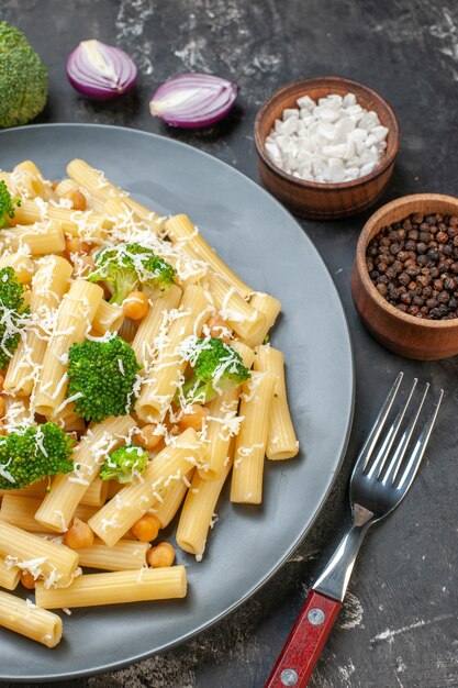 Top view cooked pasta with broccoli on gray background color green food meal dough photo italy pepper