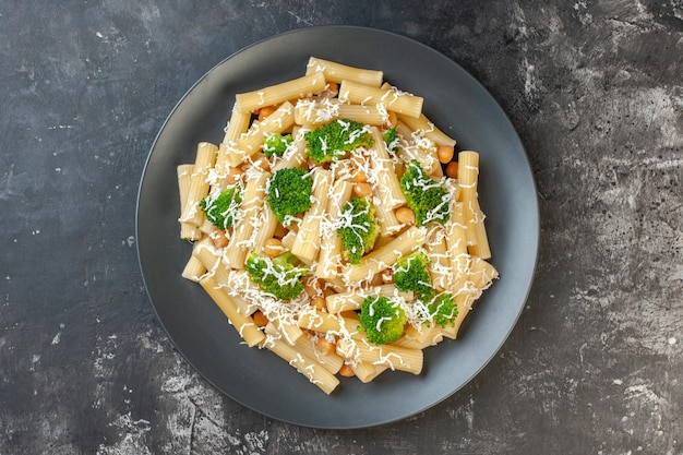 Top view cooked pasta with cheese and broccoli on light gray background color dough dish meal italy food photo green