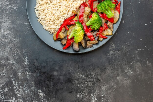 Top view cooked pearl barley with cooked with vegetables